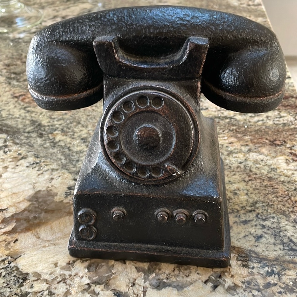 Bronze colored resin statue of an old-fashioned telephone